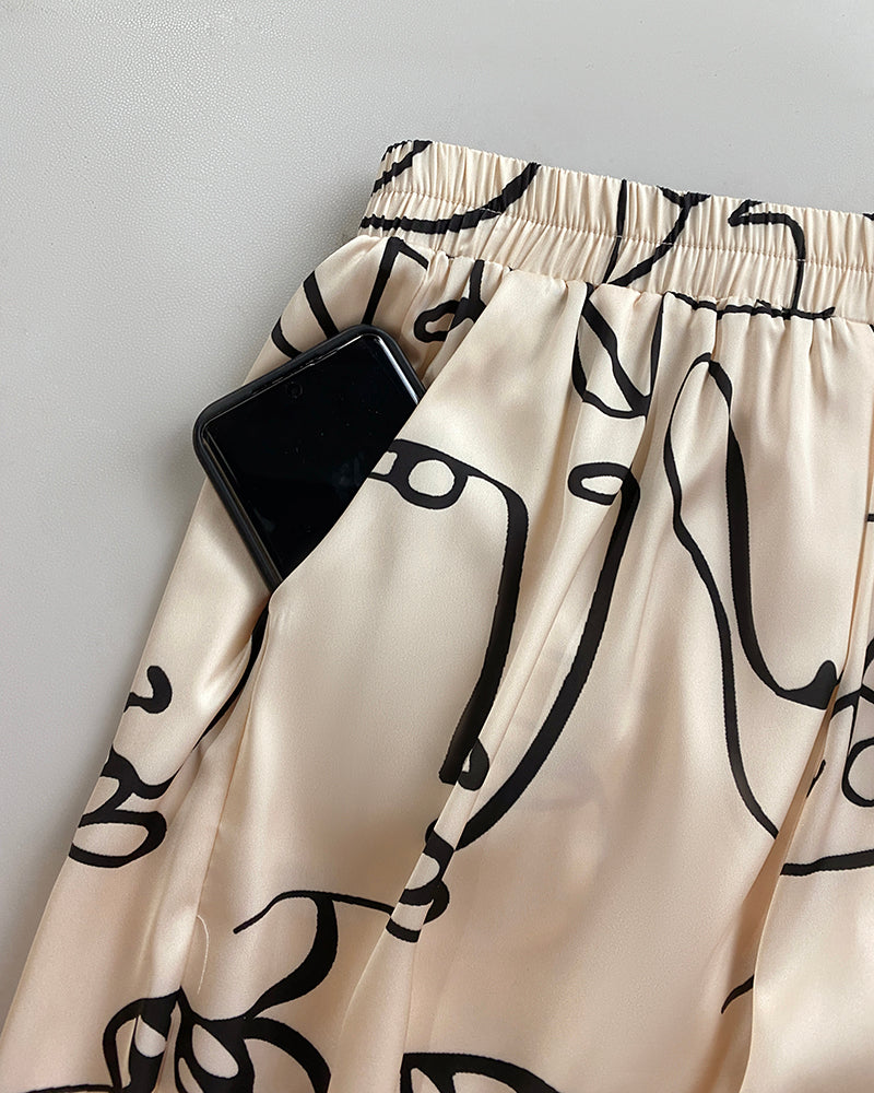 Women's Abstract Face Print Two Piece Outfits Boat Neck Batwing Sleeve Top and High Waisted Wide Leg Pants Set with Pockets